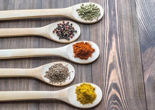 Assortment of spices on the wooden spoons