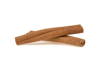 two cinnamon sticks on a white background