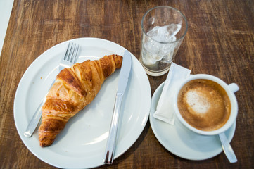 Cafe culture: iced coffee and a croissant 