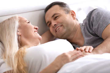 Senior couple in bed together at home