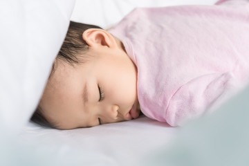 Asian baby sleeping on the bed,thailand people,relax time