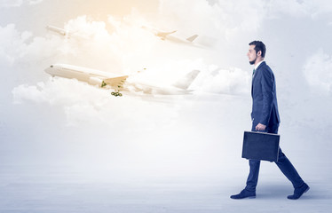 Obraz premium Businessman going somewhere with airplane