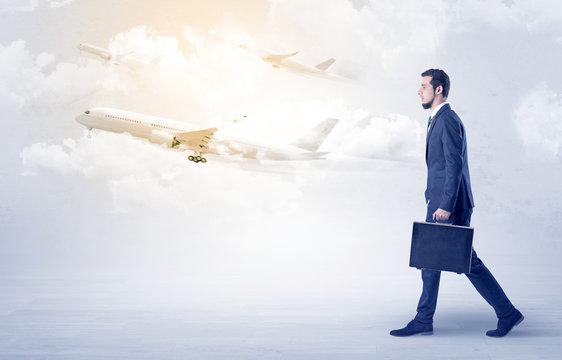 Businessman going somewhere with airplane
