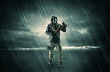 Terrorist in a room with weapons on his hand