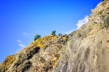 Summer sunny landscape of a stone mountain