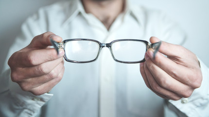 Optician showing glasses.