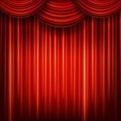 Red closed curtain with light spots in a theater