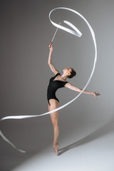 Young gymnast woman stretching and training