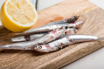 raw anchovies and sliced lemon
