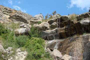 Fototapeta na wymiar a waterfall in the Crimean mountains in the dry summers.