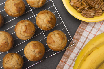 Classic Banana Nut Muffins on a Slate Cutting Board