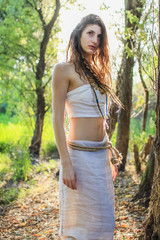 Pagan Woman curiously wondering through the forest