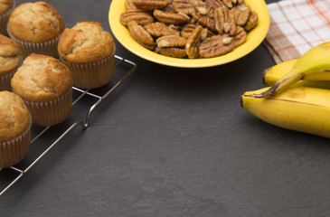 Classic Banana Nut Muffins on a Slate Cutting Board