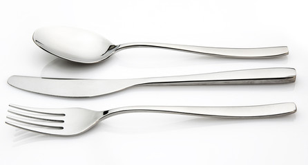 Isolated cutlery on a glossy white background - obrazy, fototapety, plakaty