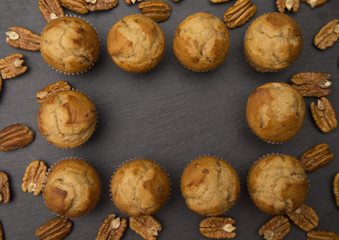 Classic Banana Nut Muffins on a Slate Cutting Board