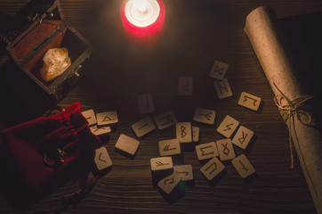 Runes scattered on the magic table of fortune teller. Scandinavian divination.