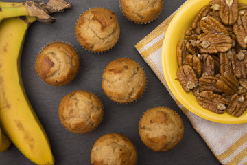 Classic Banana Nut Muffins on a Slate Cutting Board