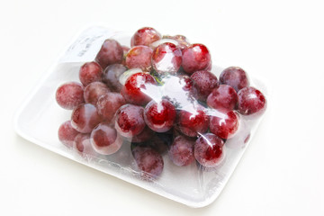 Grape in clear plastic packaging.