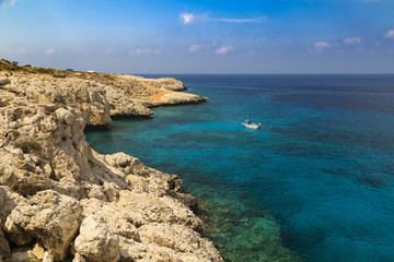 Fototapeta na wymiar Seascape with rocks on the shore of the Mediterranean Sea.