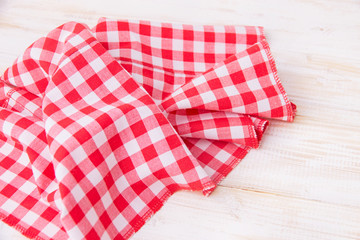 Tablecloth in a cage on a wooden table