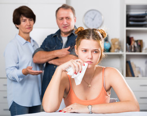 Adult woman is upseting and her parents are sympathying with her