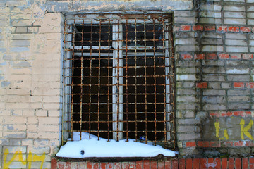 The ruins of the city, an abandoned military base, brick walls, bars on the Windows