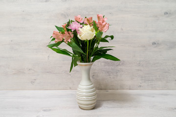 Colorful spring bouquet of rose, chrysanthemum and alstroemeria flowers in a vase