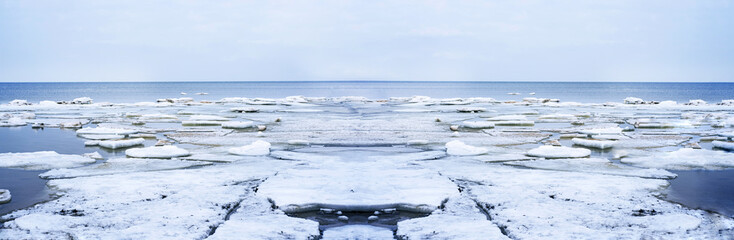 Ice drift on Baltic sea. Spring cloudy day.