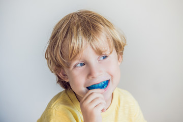 Three-year old boy shows myofunctional trainer to illuminate mouth breathing habit. Helps equalize...
