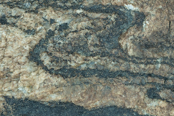 the surface of the stone is brownish-gray