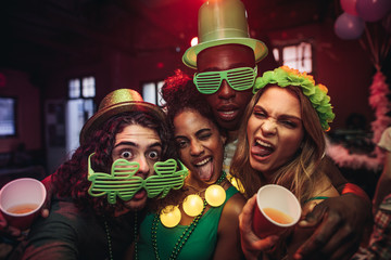 Friends having amazing celebration of St.Patrick's day at pub