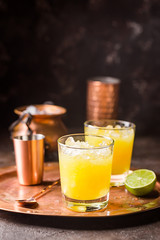 Orange cocktail decorated with lime