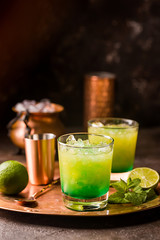 Orange cocktail decorated with lime