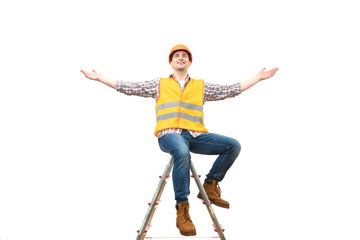 The happy engineer on the ladder gesturing on the white background