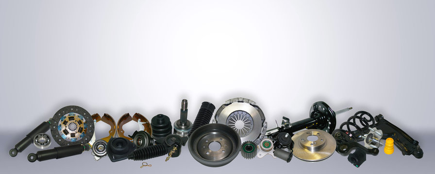 Spare parts car on the grey background set. Many auto parts are located on the edge of the image. OEM parts, auto parts for customer.