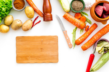 cut vegetables for cooking ragout or ratatouille for healthy dinner white background top view space...