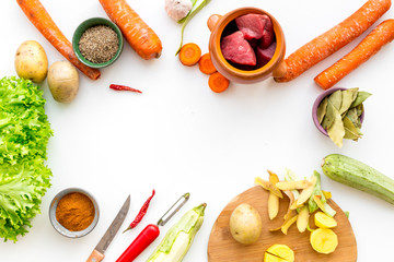 cut vegetables for cooking ragout or ratatouille for healthy dinner white background top view space for text