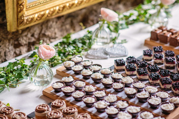 different types of sweet dessert on board, patisserie, healthy cakes