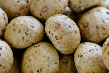 freshly baked buns with grains closeup photo background