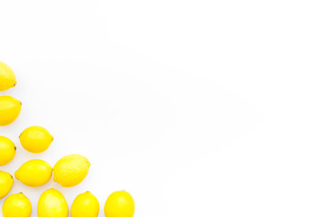 yellow citrus fruit set with lemons white background top view mock-up