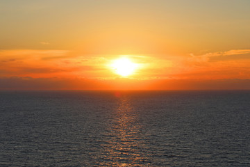 Sea and sunset with sun rays.