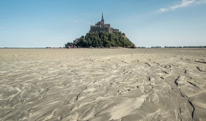 Fototapeten View on Mont Saint-Michel from within the bay at low tide © Erik_AJV