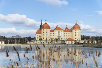 Castle Moritzburg in Dresden with reflections in the ice in the winter.
