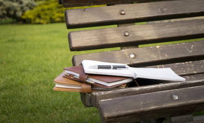 Fototapeta premium Notebooks on the bench