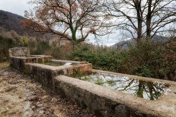 Fototapeta premium Watering hole for the animals consisting of three tanks filled with water
