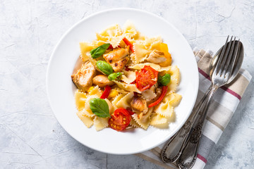 Pasta with chicken and vegetables top view.