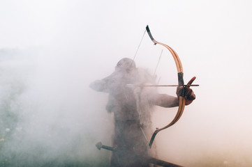  archer in the fog - obrazy, fototapety, plakaty
