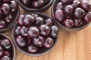 Acai fruits in wooden bowls - Euterpe oleracea
