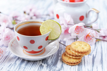 morning breakfast of tea in a cup of colorful peas with cookies