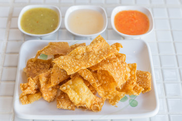 yellow flour sheet fried in small plate, asia snack.